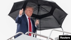 US President Trump boards Air Force One as he departs for the Middle East on October 12.