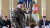 Украинадағы «Оңшыл сектор» қозғалысының белсендіcі Александр Музычко (ортада). 9 наурыз 2014 жыл.
